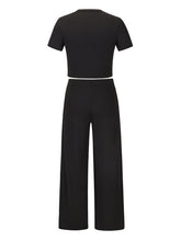 Women's solid color round neck short-sleeved T-shirt + trousers two-piece set